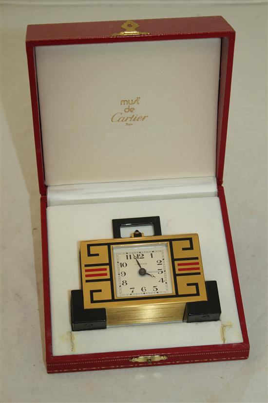 A Must de Cartier enamelled and lacquered brass desk timepiece, 4in., in original Cartier fitted case